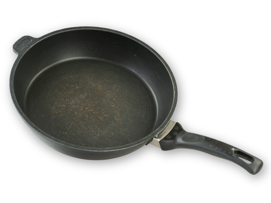 Very dirty and overheated old pan with side handle and handle.